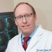 Christopher E. Comstock MD, FACR, FSBI